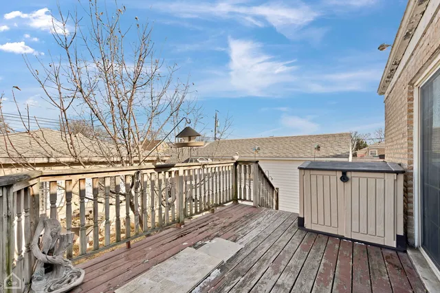 a view of balcony with wooden floor