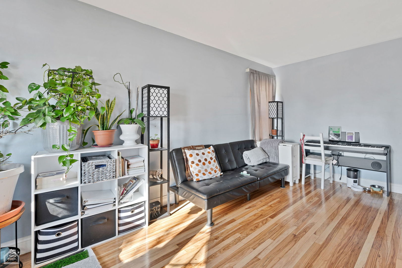 3736 West 70th Street Chicago, IL 60629 - Photo 4 of 21 a living room with furniture and a wooden floor