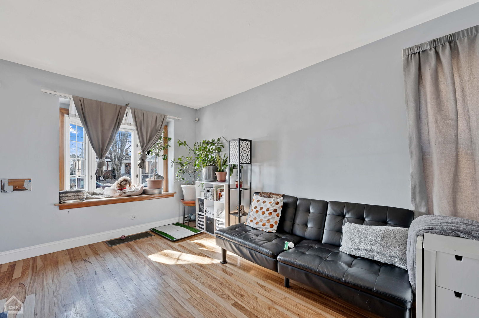 3736 West 70th Street Chicago, IL 60629 - Photo 5 of 21 a living room with furniture and a window