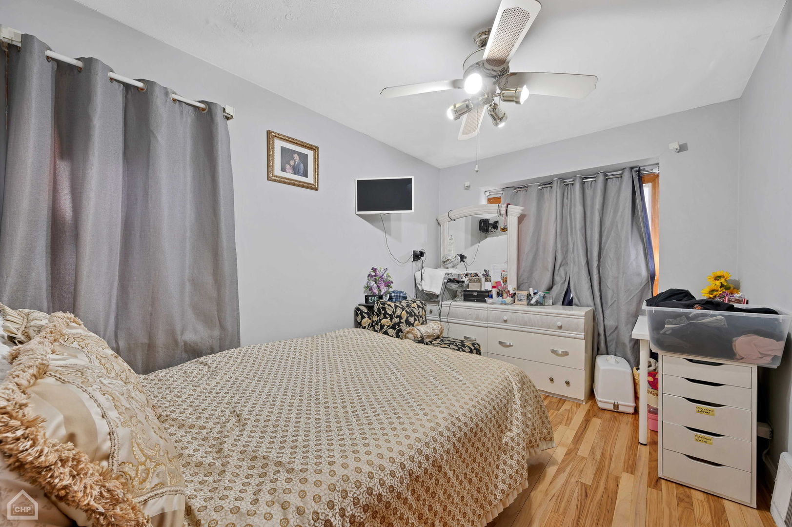 3736 West 70th Street Chicago, IL 60629 - Photo 6 of 21 a bedroom with a bed and a dresser