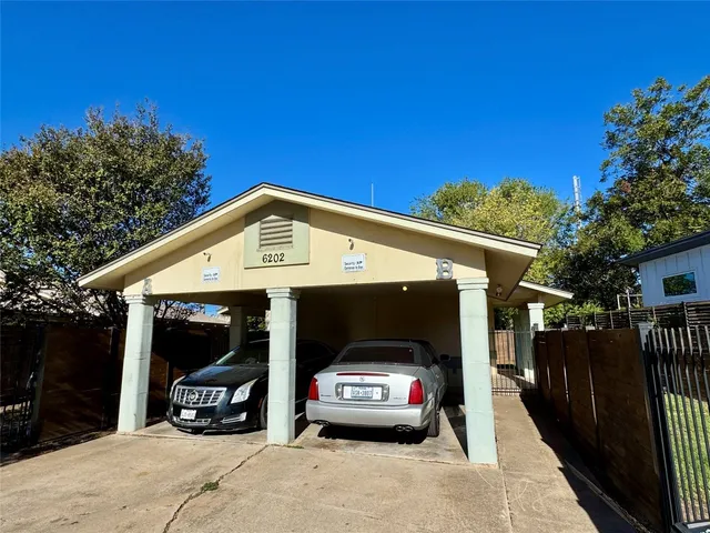 a view of a car parked in front of a house