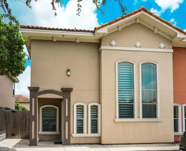 a front view of a house with stairs
