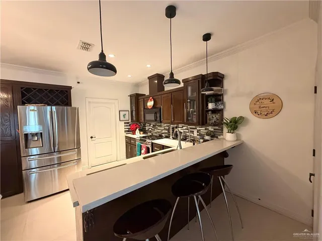 a kitchen with refrigerator and countertop