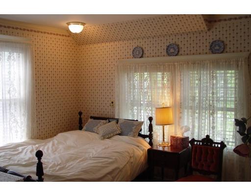 40 Huntley Road Quincy, MA 02169 - Photo 11 of 15 a bedroom with a bed and a window