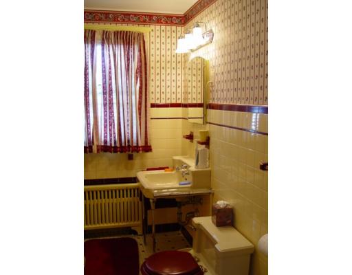 40 Huntley Road Quincy, MA 02169 - Photo 12 of 15 a bathroom with a sink and a mirror