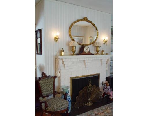 40 Huntley Road Quincy, MA 02169 - Photo 4 of 15 a living room with furniture and a fireplace