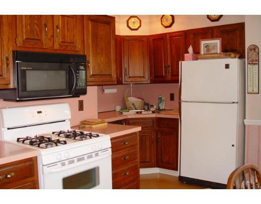 40 Huntley Road Quincy, MA 02169 - Photo 9 of 15 a kitchen with stainless steel appliances granite countertop a refrigerator stove a sink and dishwasher