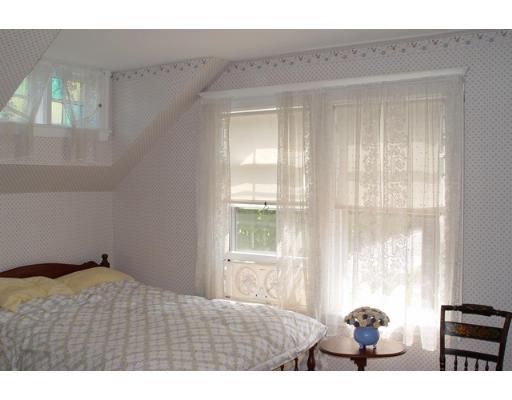 40 Huntley Road Quincy, MA 02169 - Photo 10 of 15 a bedroom with a bed and a large window