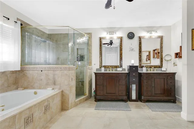 a bathroom with a tub sink and mirror