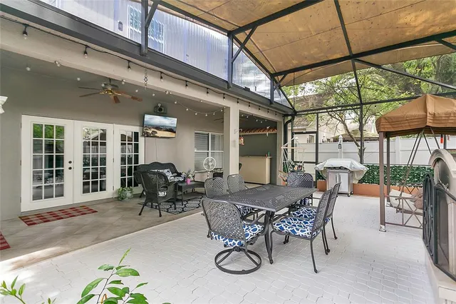 a view of an outdoor dining space with a patio