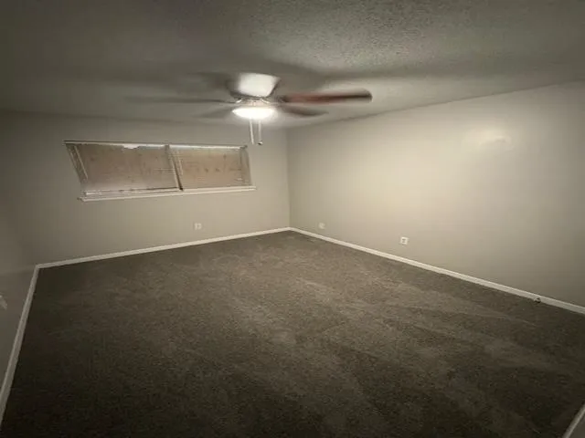 an empty room with a empty space and windows