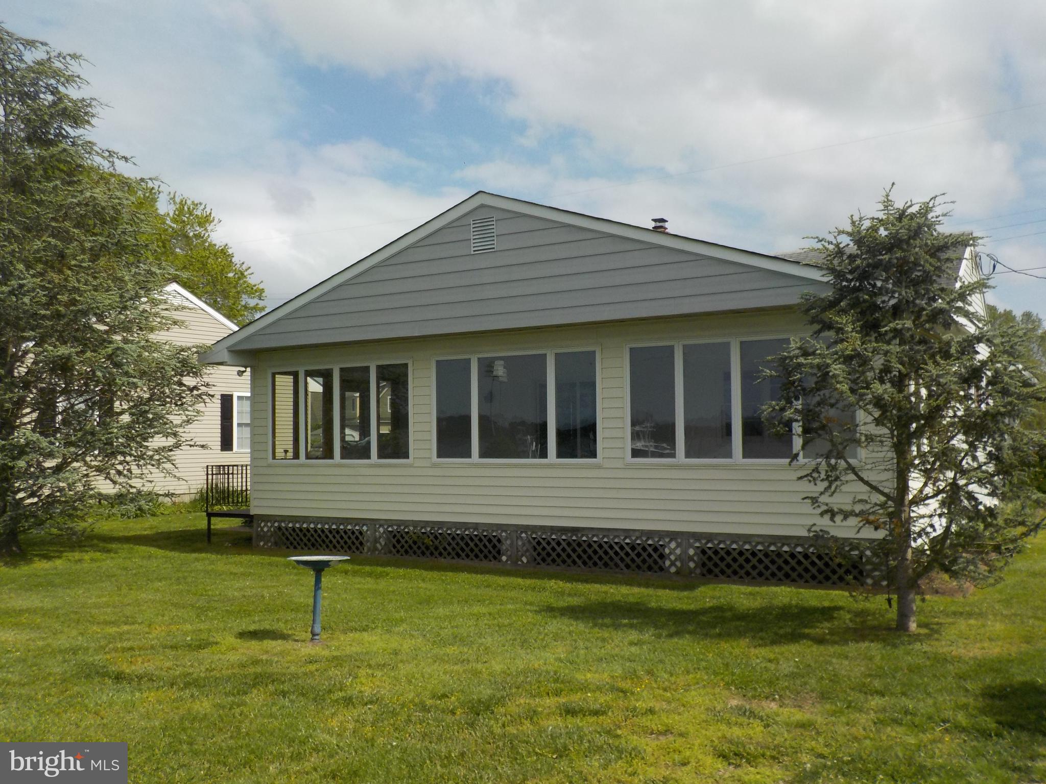 1602 Deep Point Road Woolford, MD 21677 - Photo 3 of 90 a front view of a house with a yard