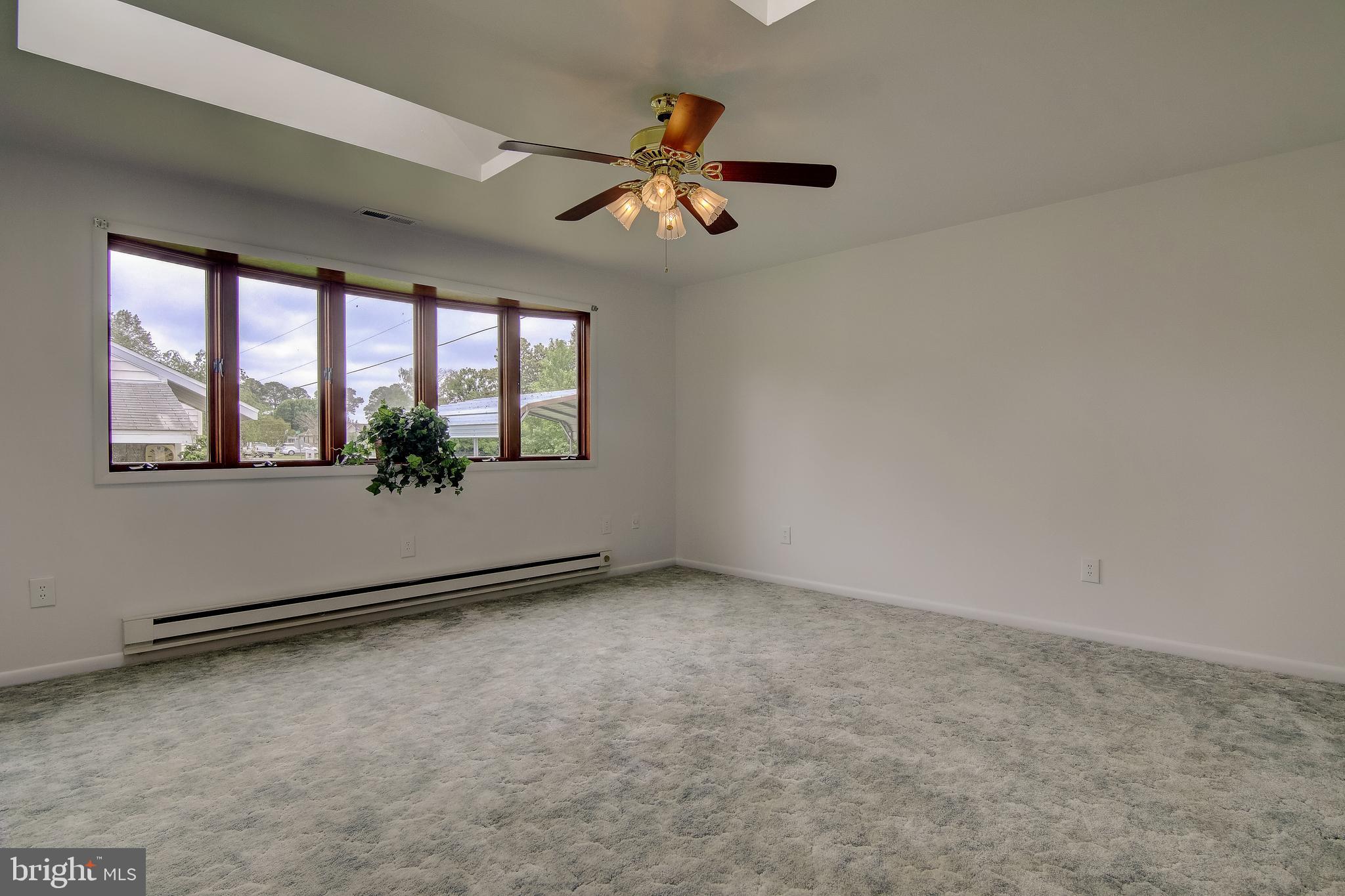 1602 Deep Point Road Woolford, MD 21677 - Photo 50 of 90 an empty room with windows and ceiling fan