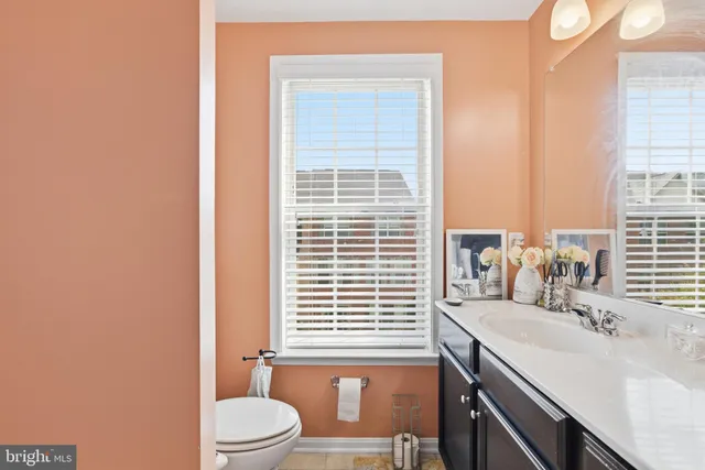 a bathroom with a sink a toilet and tub