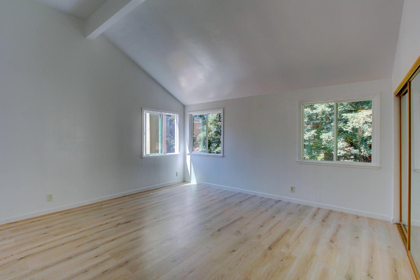 258 Paseo Bernal Moraga, CA 94556 - Photo 13 of 43 a view of an empty room with wooden floor and a window