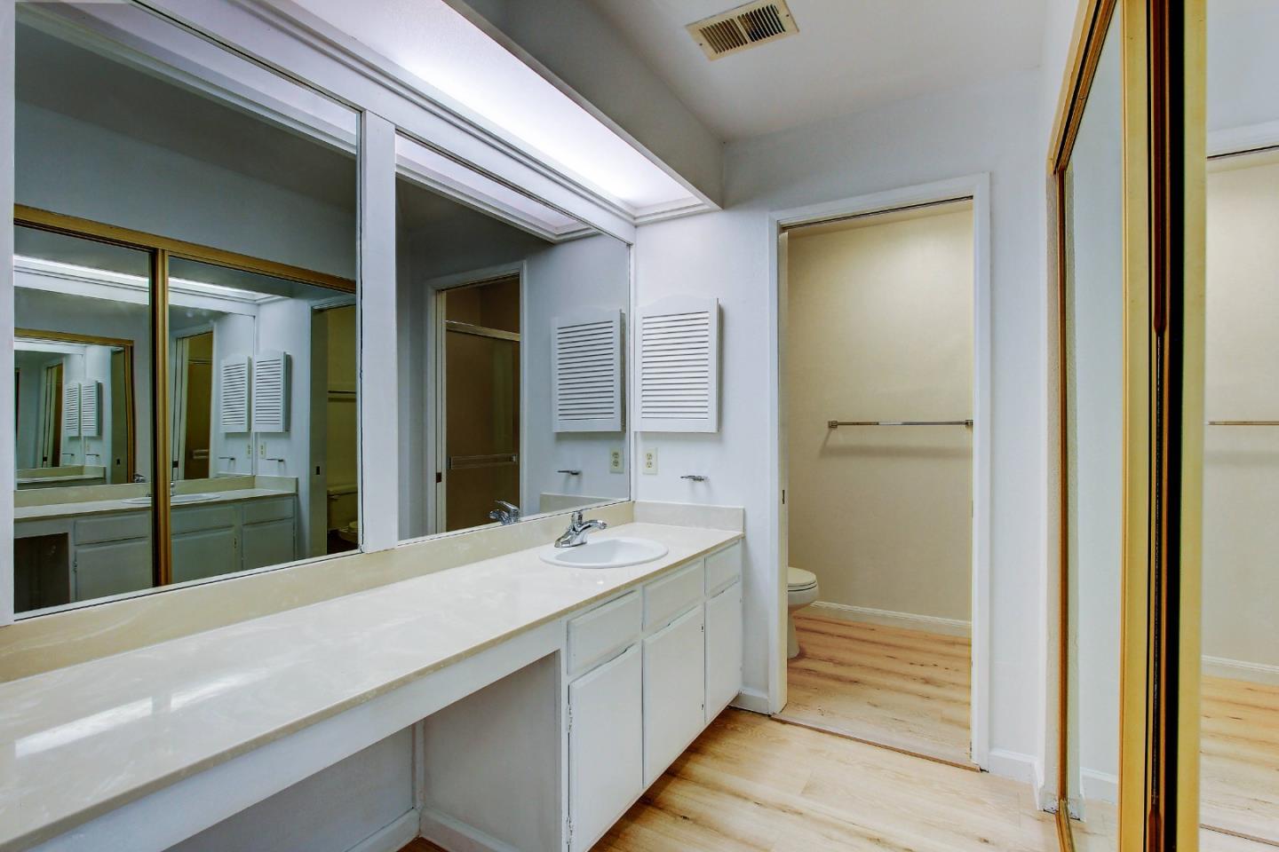 258 Paseo Bernal Moraga, CA 94556 - Photo 17 of 43 a bathroom with a double vanity sink and mirror with bathtub