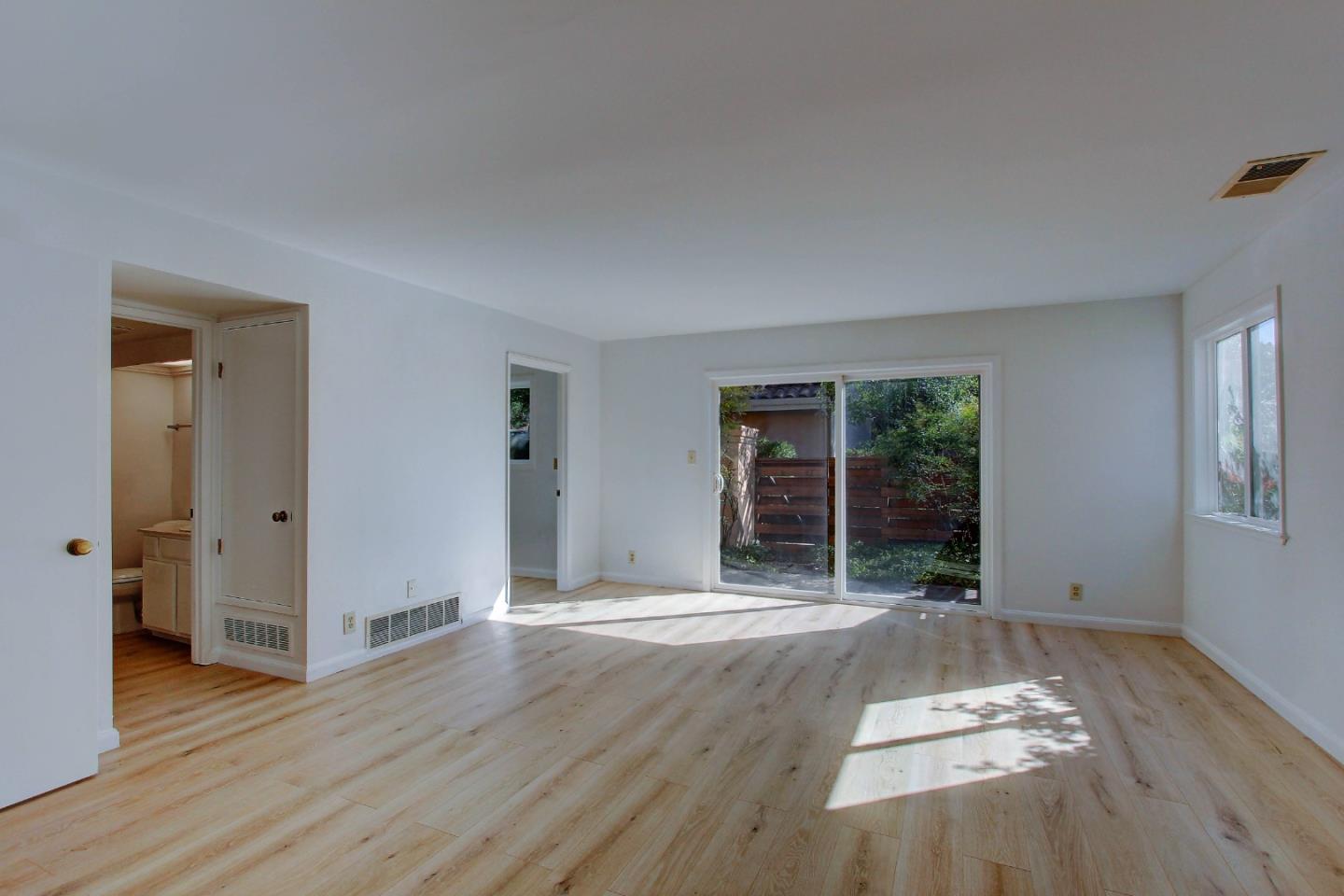 258 Paseo Bernal Moraga, CA 94556 - Photo 23 of 43 a view of an empty room with wooden floor and a window