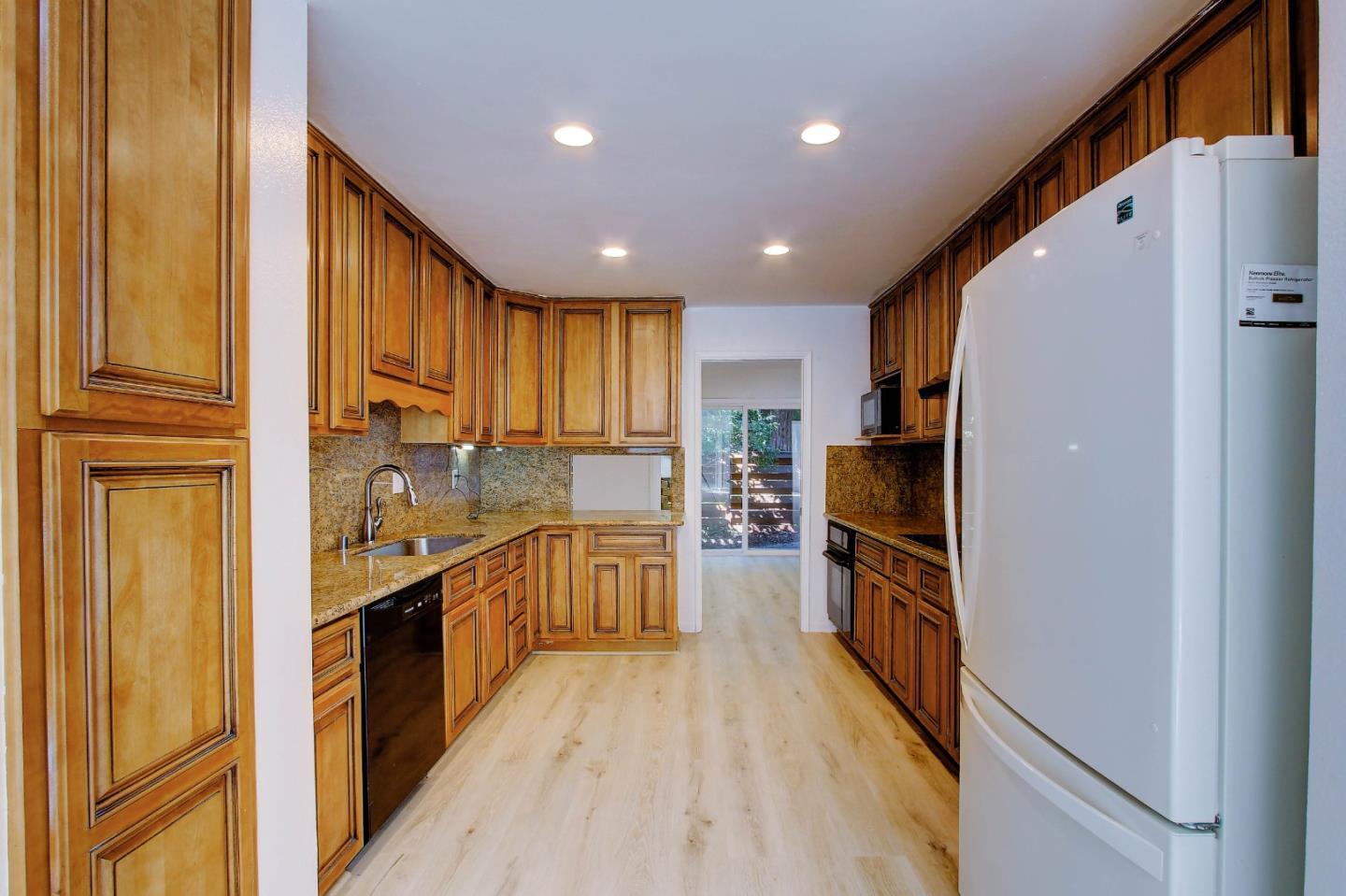 258 Paseo Bernal Moraga, CA 94556 - Photo 25 of 43 a kitchen with stainless steel appliances granite countertop refrigerator a sink dishwasher stove and oven