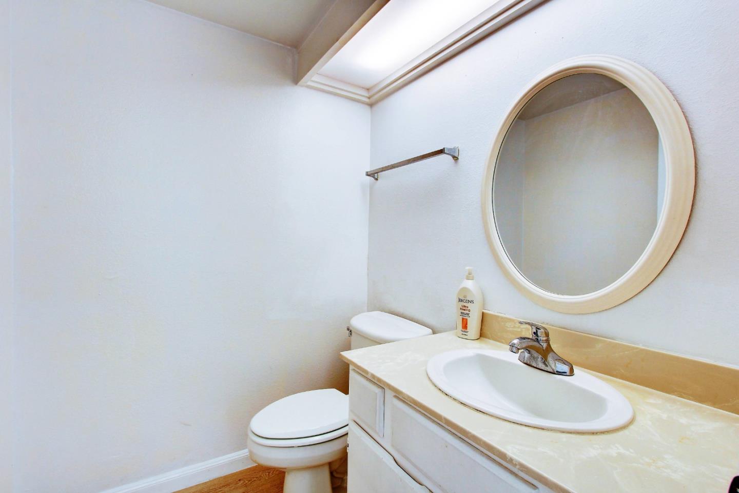 258 Paseo Bernal Moraga, CA 94556 - Photo 30 of 43 a bathroom with a sink a toilet and a mirror