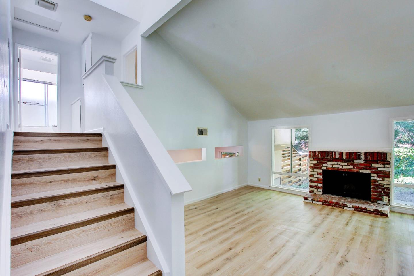 258 Paseo Bernal Moraga, CA 94556 - Photo 6 of 43 a view of a livingroom with wooden floor and a ceiling fan