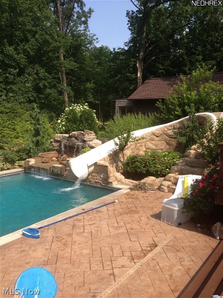 452 Forestview Road Bay Village, OH 44140 - Photo 18 of 24 stunning in-ground pool with automatic cover, buit-in slide and waterfall