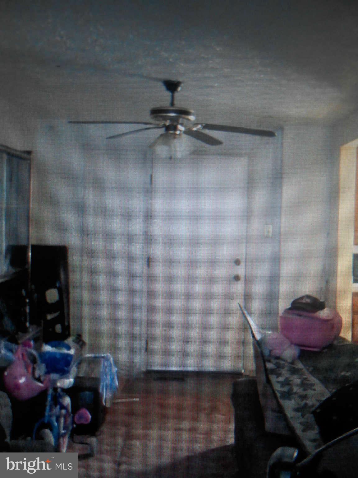 2405 Ridgely Street Baltimore, MD 21230 - Photo 3 of 4 a room with furniture and a flat screen tv