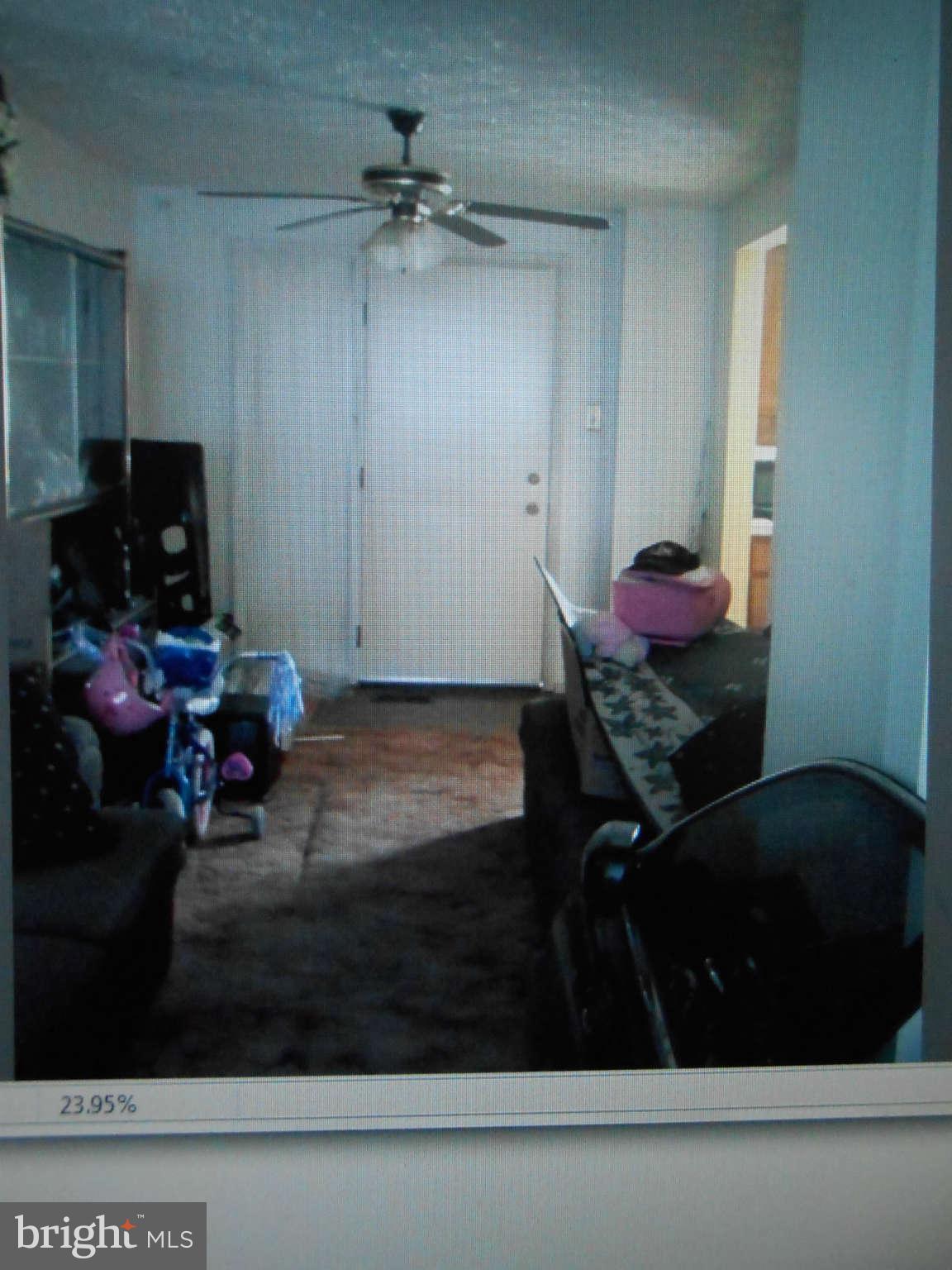 2405 Ridgely Street Baltimore, MD 21230 - Photo 4 of 4 a room with lots of furniture and clutter