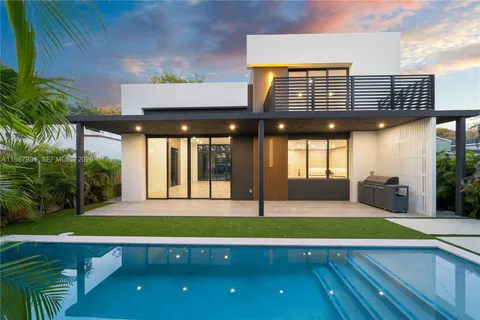 a view of an house with swimming pool and porch