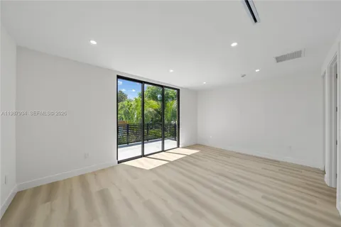 a balcony with view of yard