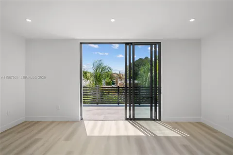 a bathroom with a shower sink and toilet