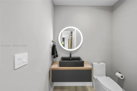 a kitchen with a stove and a window