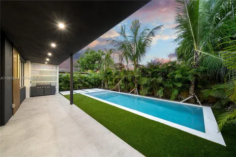 a view of swimming pool from a balcony