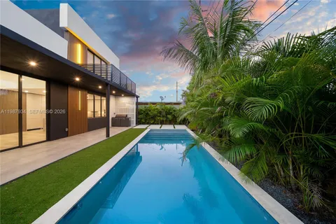a balcony with view of swimming pool