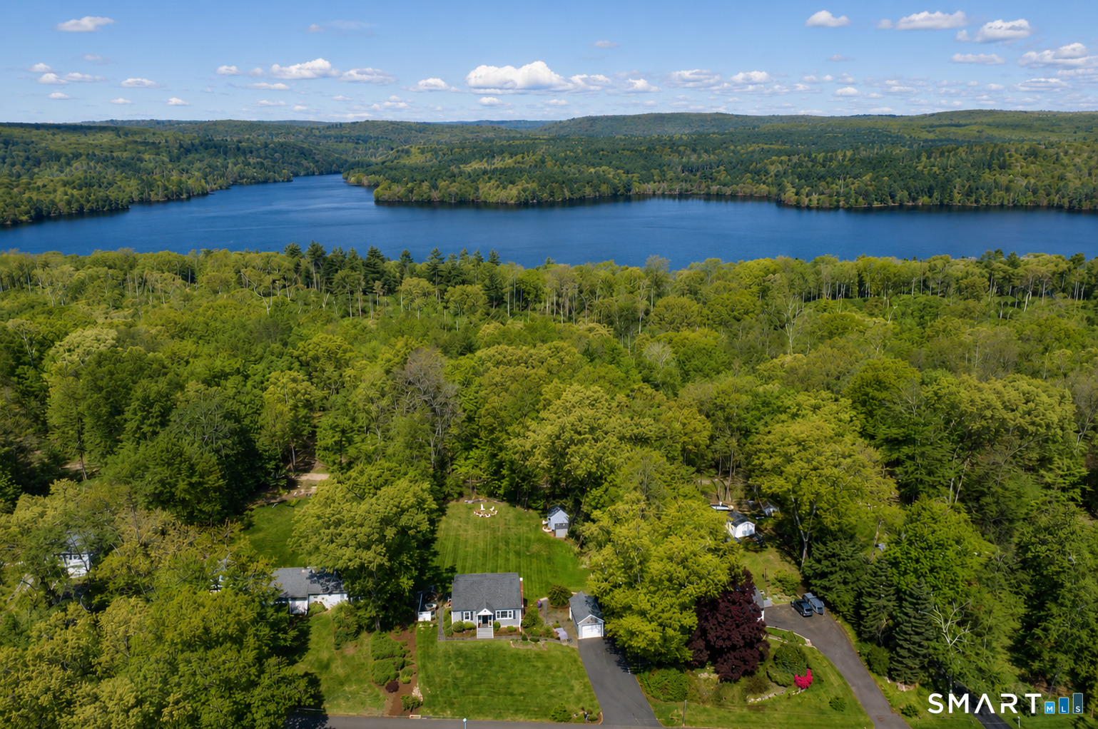 39 Freedom Drive Canton, CT 06019 - Photo 34 of 37 an aerial view of a house with a garden and lake view