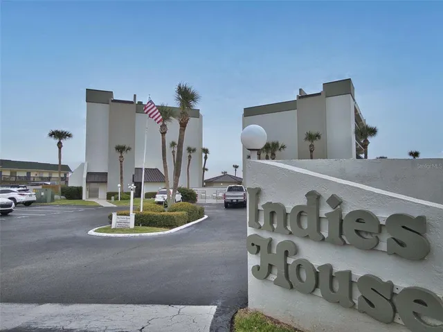 a view of living room with furniture and floor to ceiling windows