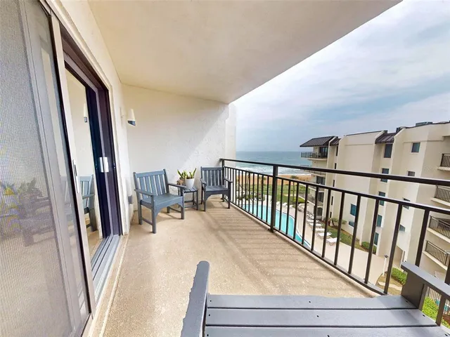 a bedroom with a bed and a dresser in it