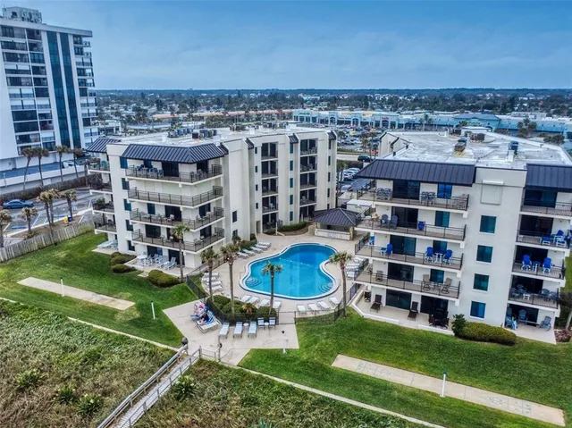 a view of a living room and kitchen