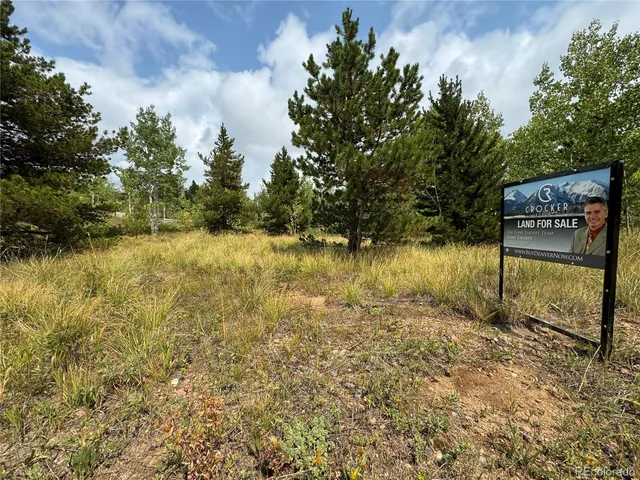 a view of lake with tree in the background