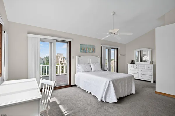 a living room with furniture a rug and a window