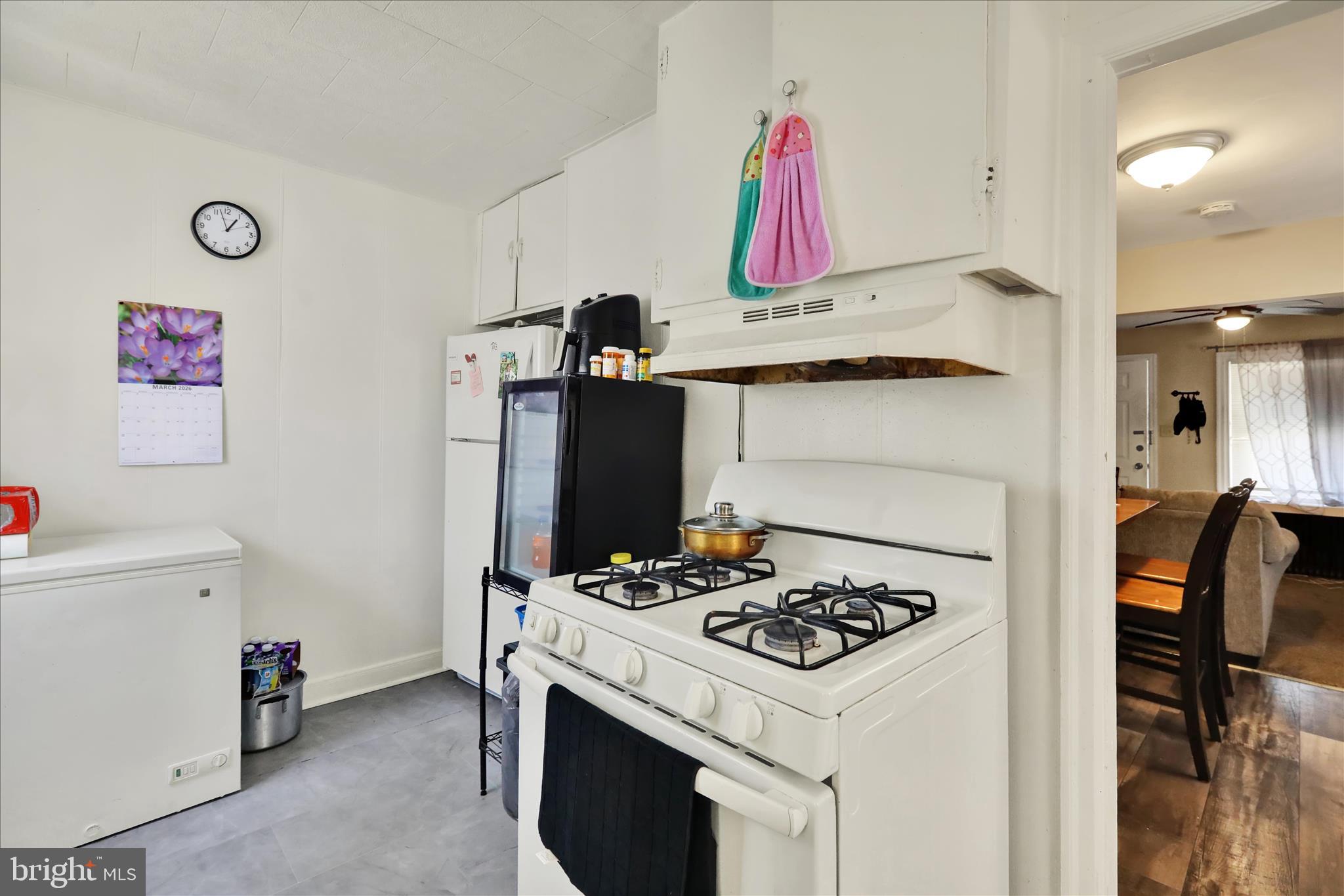 655 South Ann Street Lancaster, PA 17602 - Photo 6 of 18 a kitchen with a stove and a refrigerator