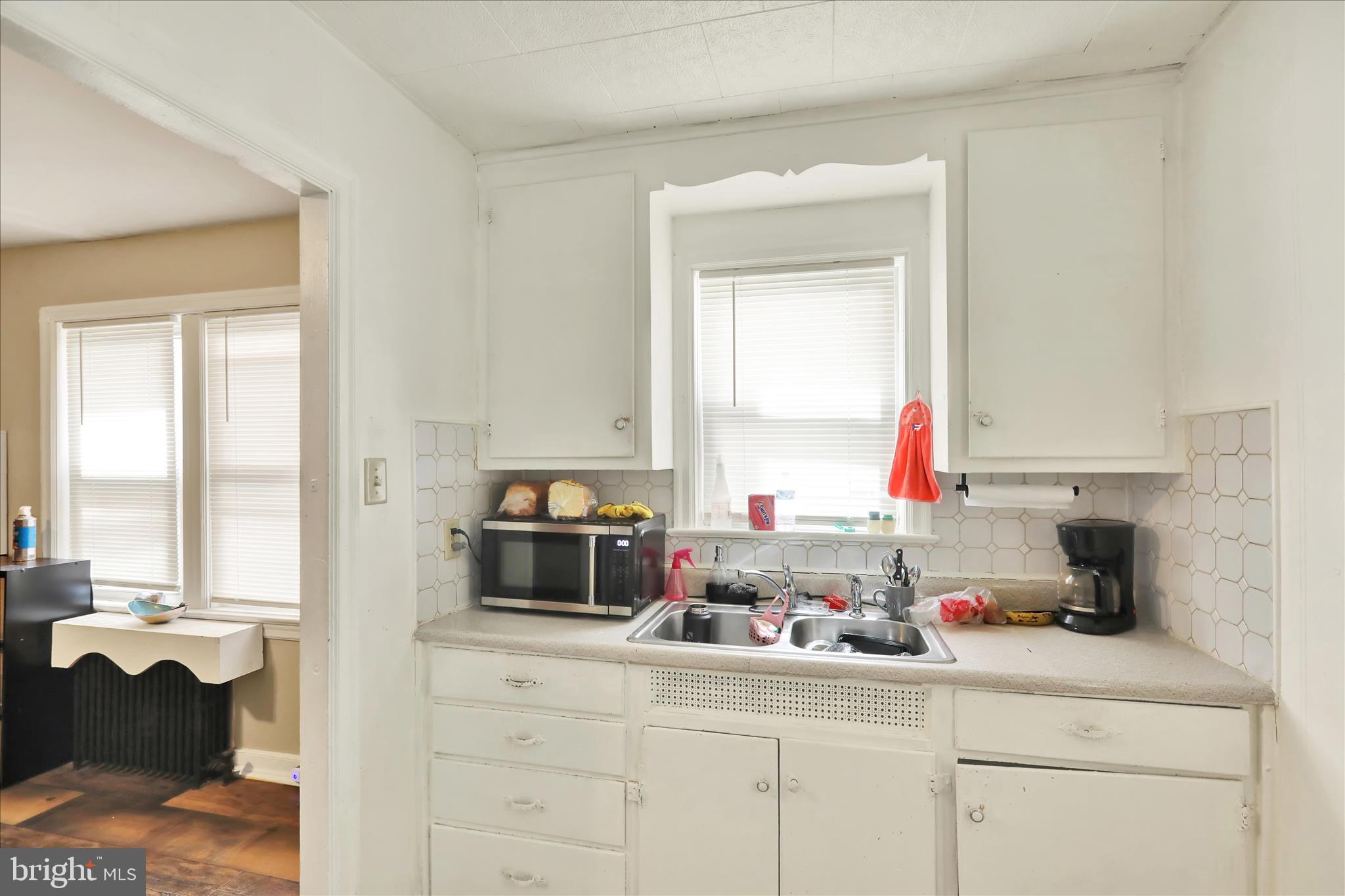 655 South Ann Street Lancaster, PA 17602 - Photo 7 of 18 a kitchen with a sink and a stove top oven