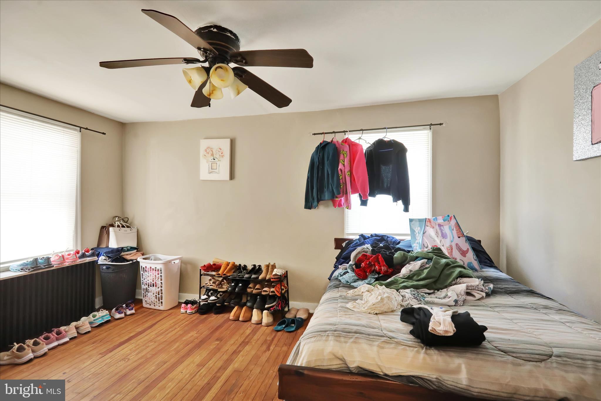 655 South Ann Street Lancaster, PA 17602 - Photo 8 of 18 a bed room with a bed and a chandelier