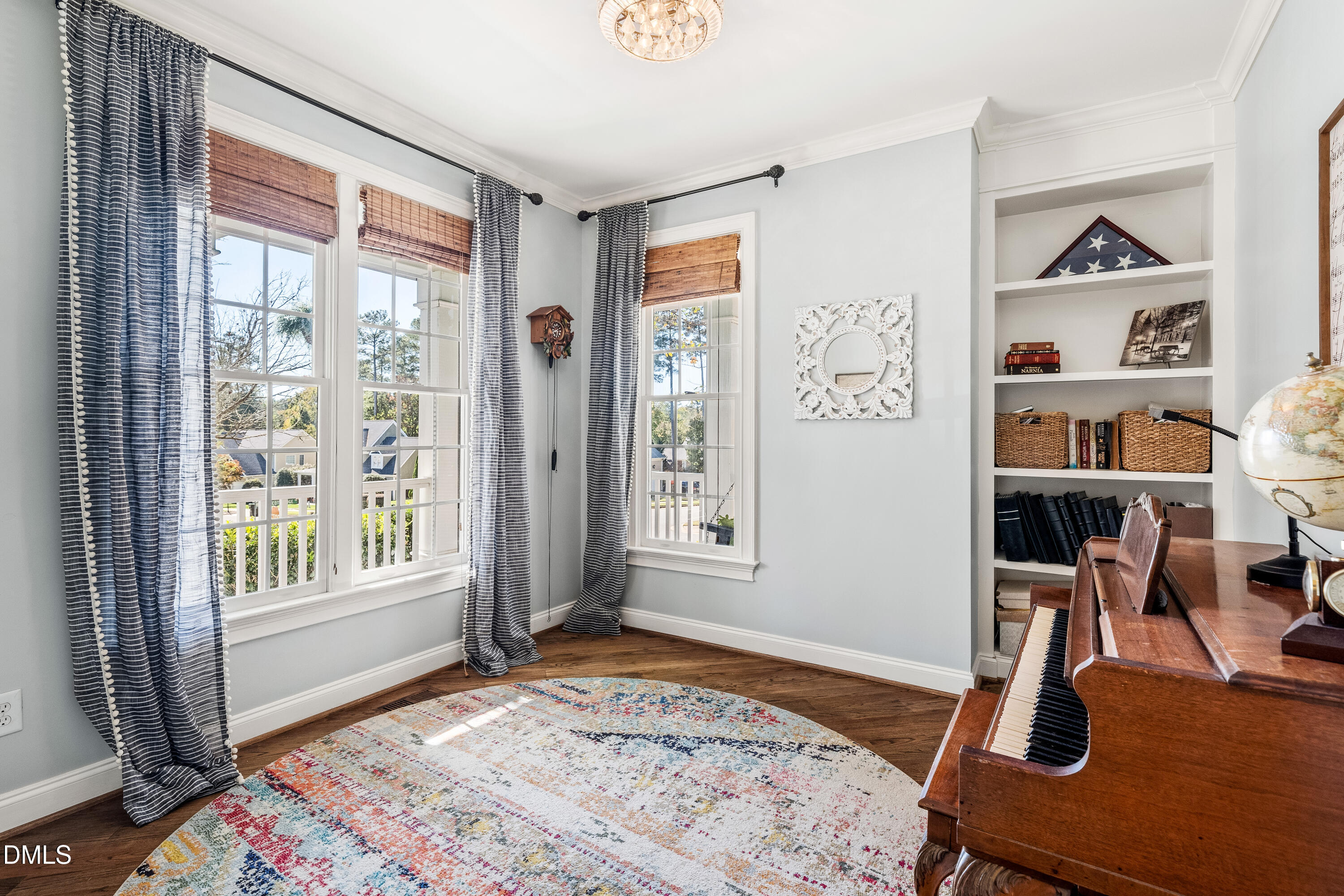 501 Wescott Ridge Drive Holly Springs, NC 27540 - Photo 24 of 52 a bedroom with furniture and a window