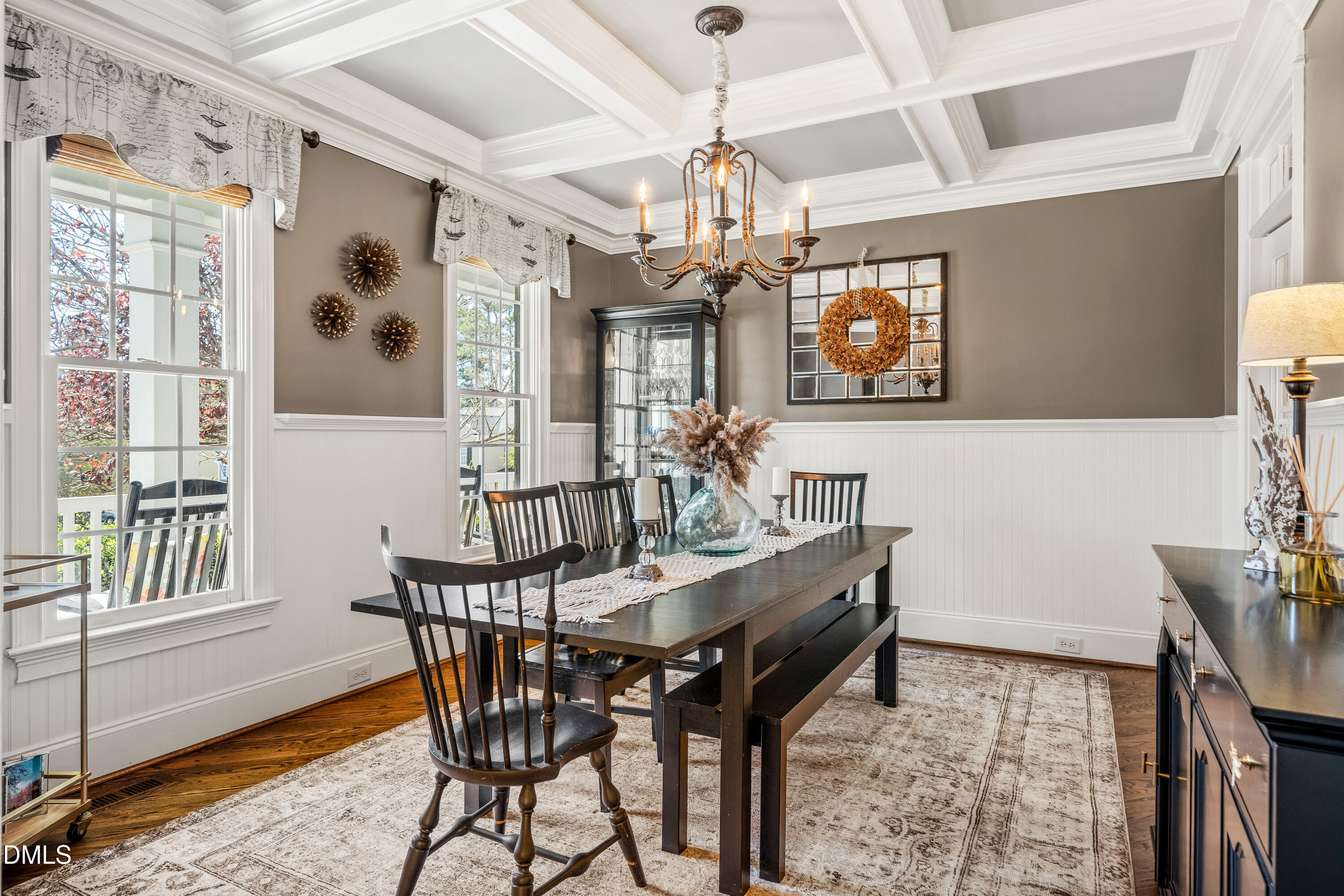 501 Wescott Ridge Drive Holly Springs, NC 27540 - Photo 7 of 52 a view of a dining room with furniture a chandelier and wooden floor