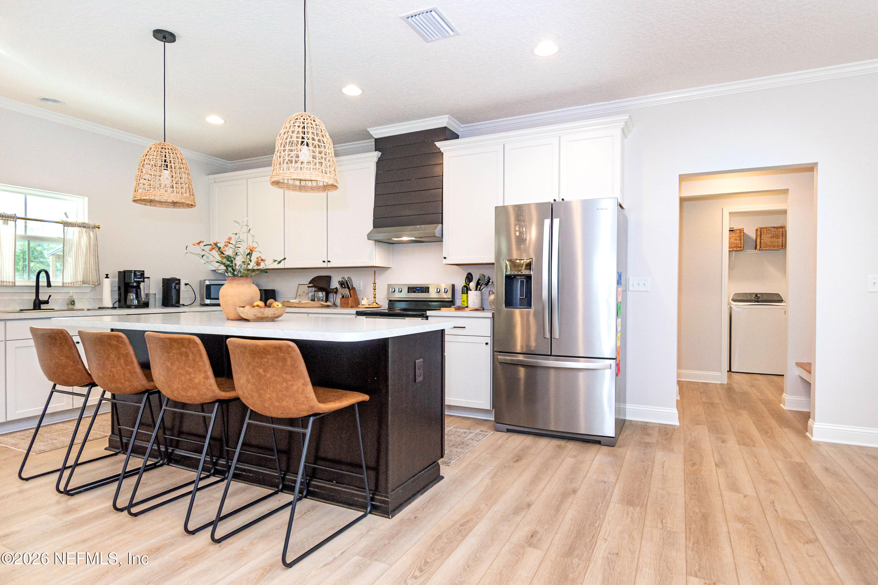 10800 Plummer Road Jacksonville, FL 32219 - Photo 12 of 67 a kitchen with stainless steel appliances granite countertop a refrigerator a sink dishwasher a stove and white cabinets with wooden floor