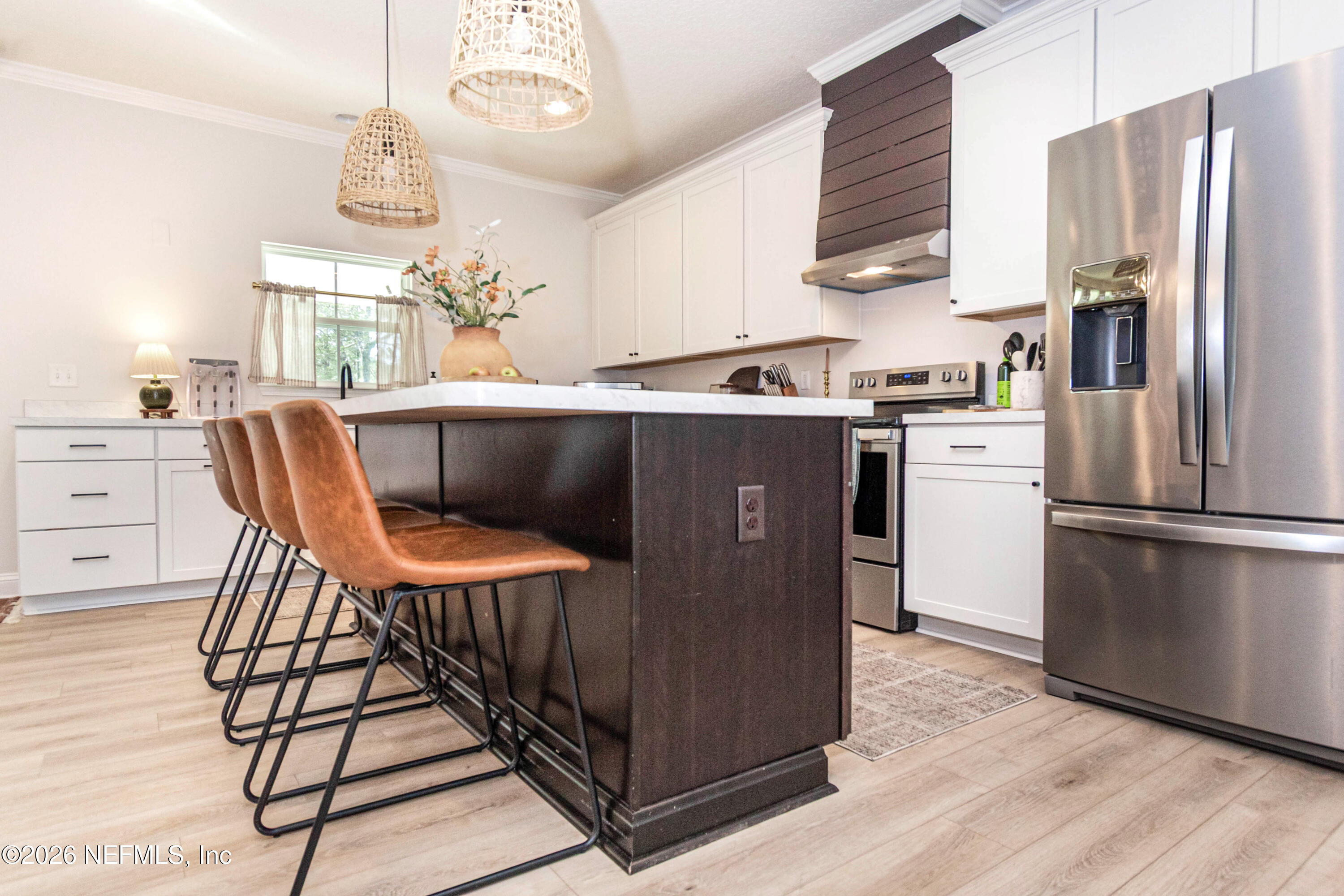 10800 Plummer Road Jacksonville, FL 32219 - Photo 13 of 67 a kitchen with stainless steel appliances granite countertop a dining table chairs a refrigerator and a window