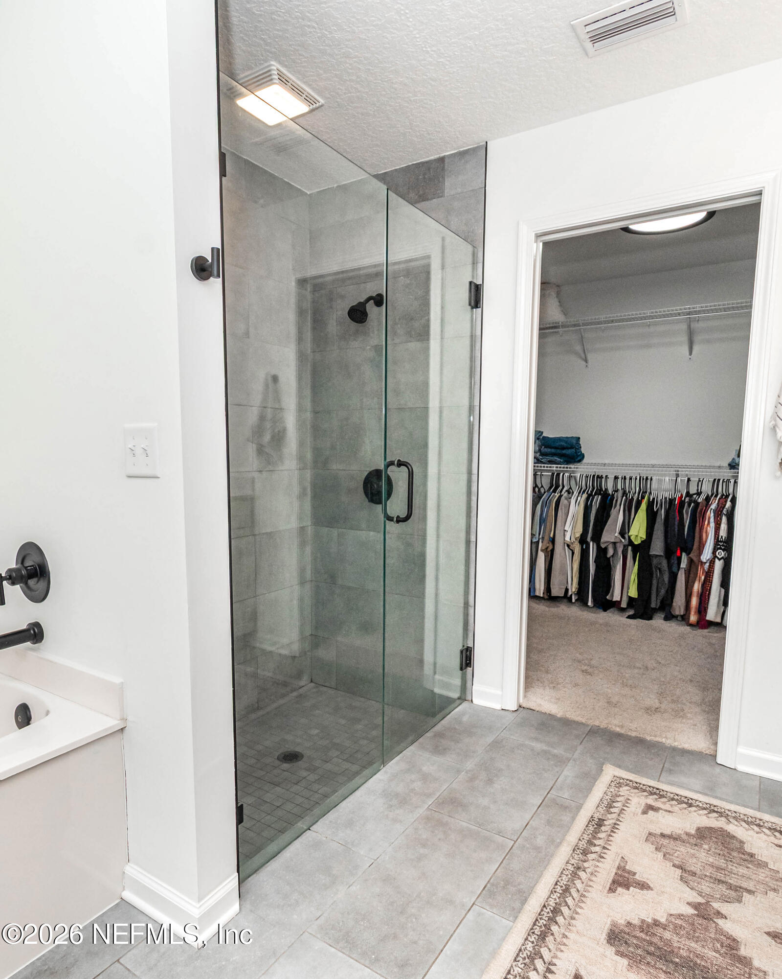 10800 Plummer Road Jacksonville, FL 32219 - Photo 28 of 67 a bathroom with a shower and a sink