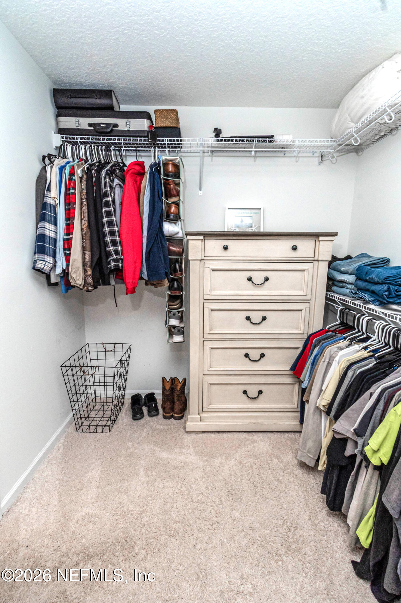 10800 Plummer Road Jacksonville, FL 32219 - Photo 30 of 67 a view of walk in closet with clothes and shoes