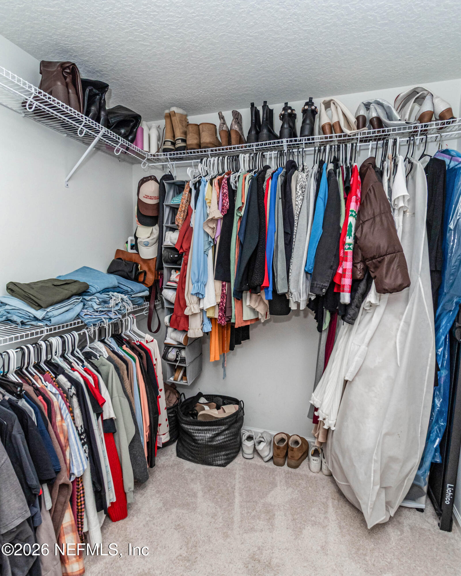 10800 Plummer Road Jacksonville, FL 32219 - Photo 31 of 67 a view of walk in closet with clothes and shoes