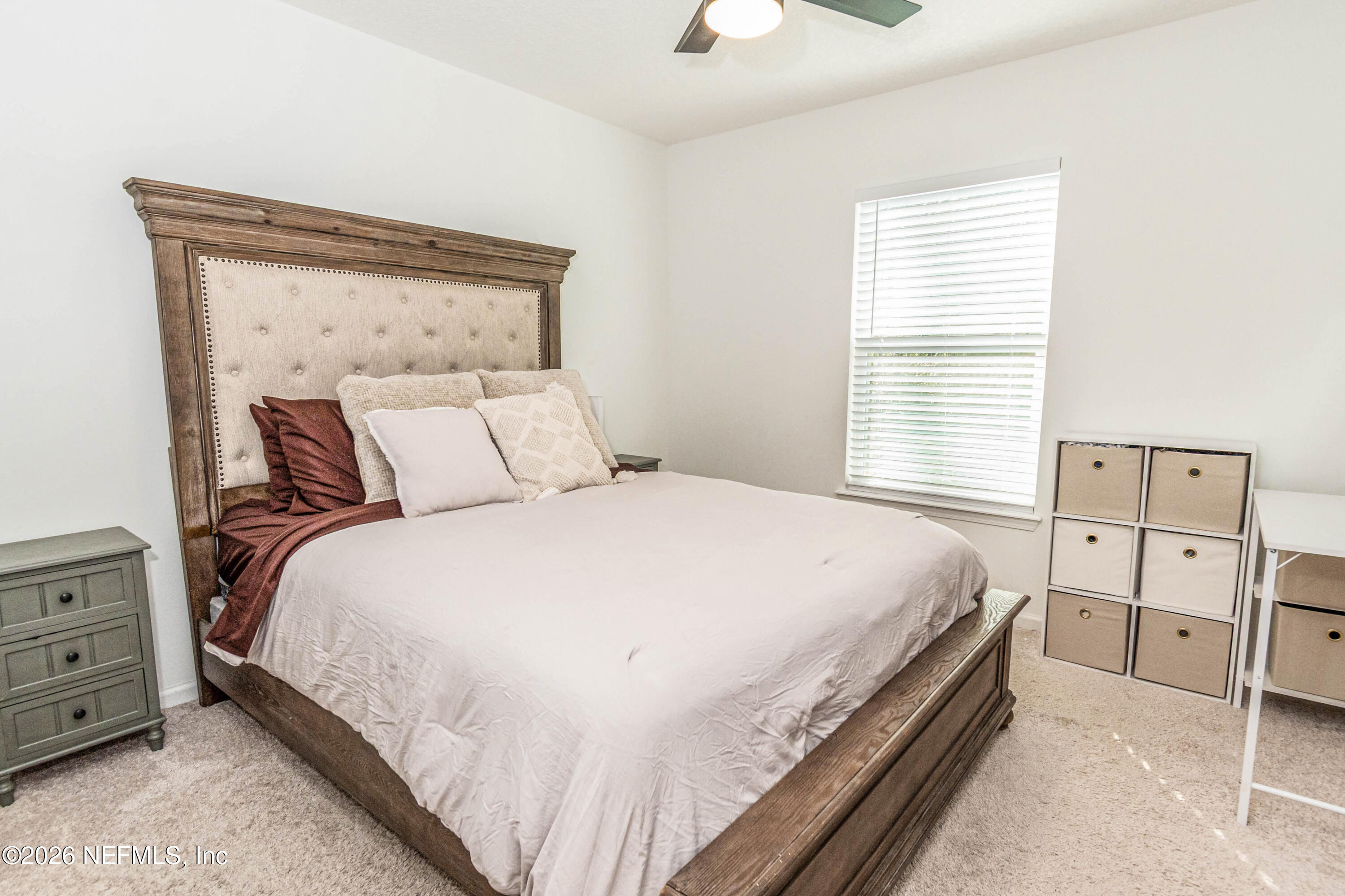 10800 Plummer Road Jacksonville, FL 32219 - Photo 32 of 67 a bedroom with a bed and a window